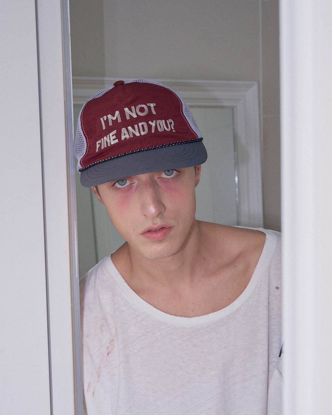 IAMNOTELITE RIPOFF RUNNING CAP BURGUNDY worn portrait angle